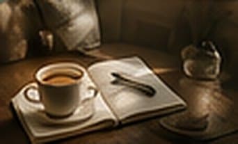 Illustration: a quiet morning table with coffee and an open notebook.